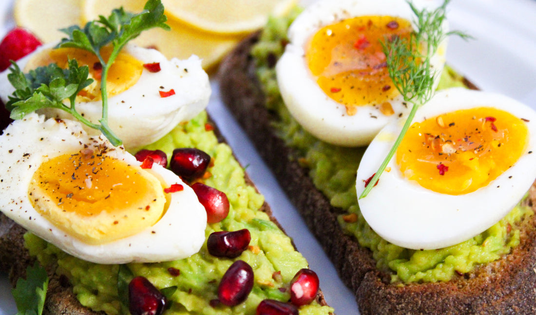 avocado on toast with egg and pomegranate